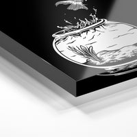 Gros plan de la matière : le tirage sous verre acrylique, tranche transparente visible.