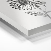 Gros plan de la matière : le tirage sous verre acrylique, tranche transparente visible.