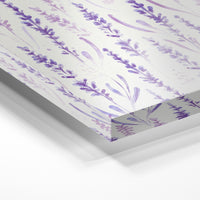 Gros plan de la matière : le tirage sous verre acrylique, tranche transparente visible.