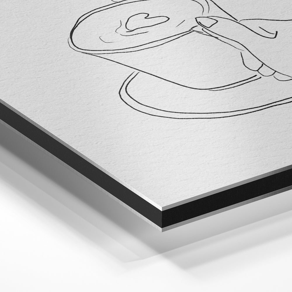 Gros plan de la matière : le tirage contrecollé sur aluminium Dibond mat, tranche visible.