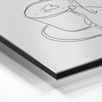 Gros plan de la matière : le tirage contrecollé sur aluminium Dibond mat, tranche visible.