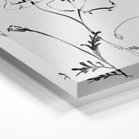 Gros plan de la matière : le tirage sous verre acrylique, tranche transparente visible.