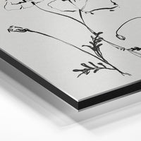 Gros plan de la matière : le tirage contrecollé sur aluminium Dibond mat, tranche visible.