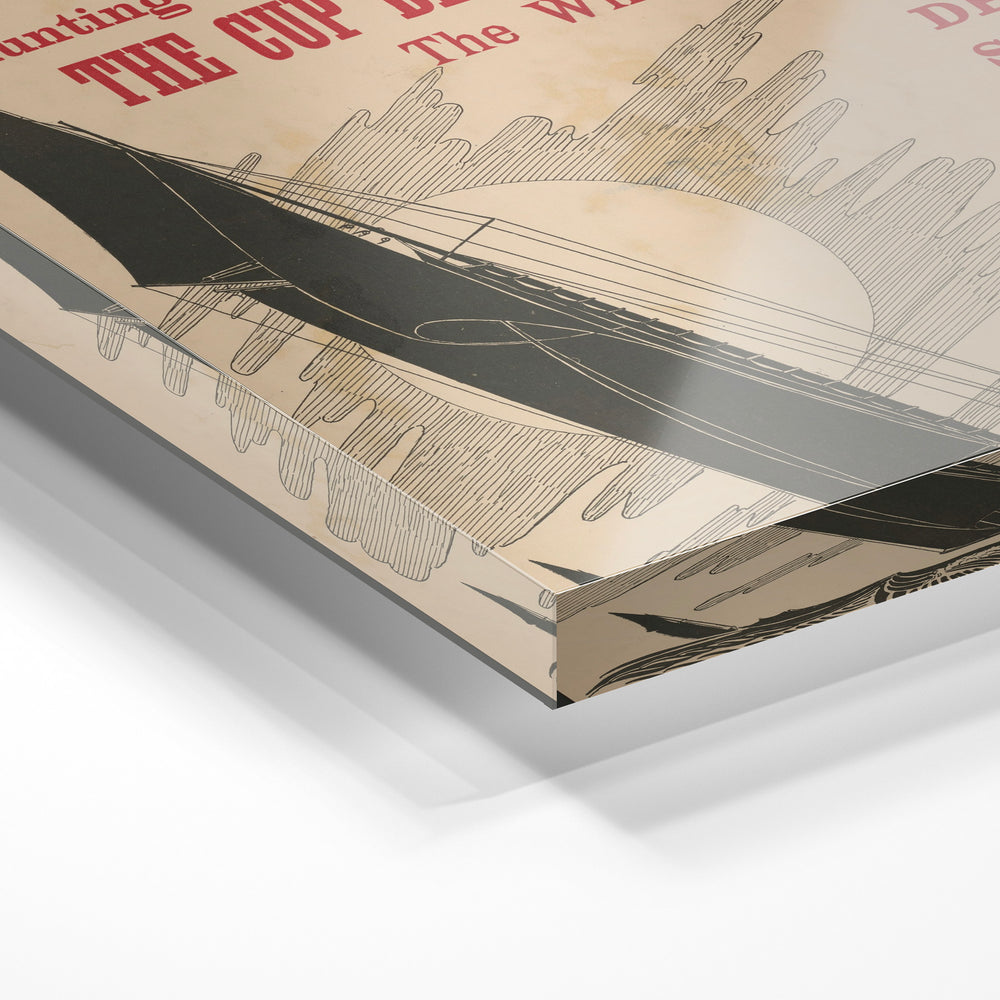Gros plan de la matière : le tirage sous verre acrylique, tranche transparente visible.