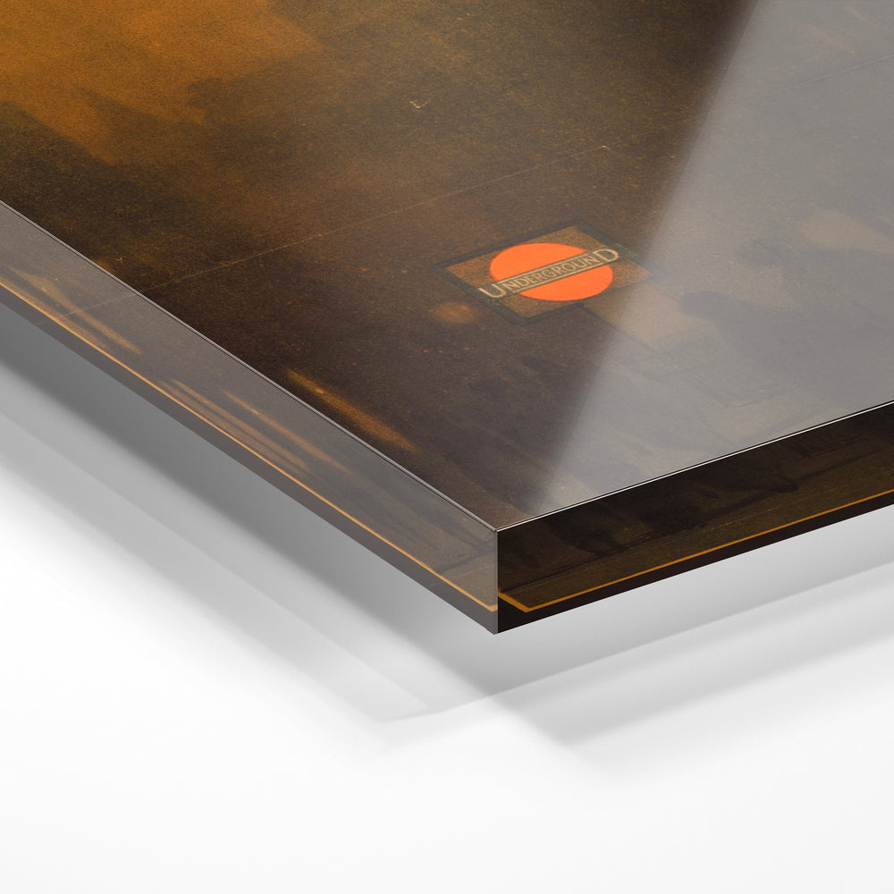Gros plan de la matière : le tirage sous verre acrylique, tranche transparente visible.