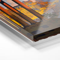 Gros plan de la matière : le tirage sous verre acrylique, tranche transparente visible.