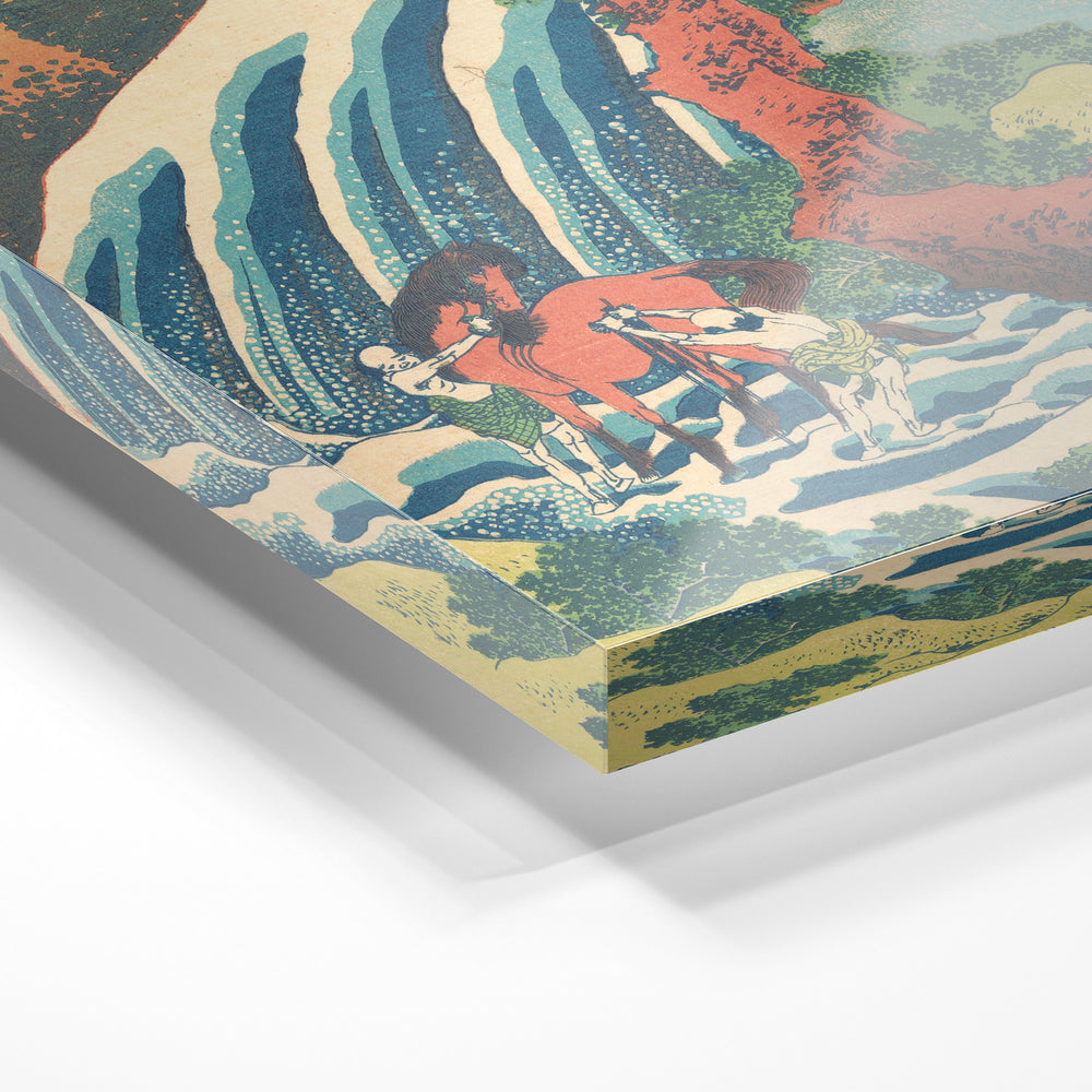 Gros plan de la matière : le tirage sous verre acrylique, tranche transparente visible.