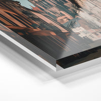 Gros plan de la matière : le tirage sous verre acrylique, tranche transparente visible.