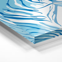 Gros plan de la matière : le tirage sous verre acrylique, tranche transparente visible.